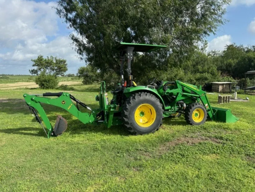 Tractor with backhoe attachment at ABM base
